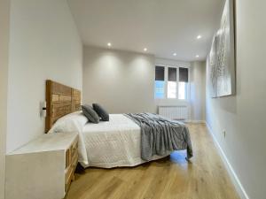 A bed or beds in a room at Mk77 - Gran Via