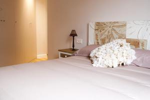 A bed or beds in a room at Mk77 - Gran Via
