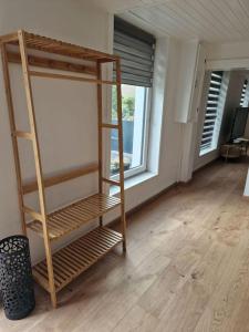a room with a bunk bed and a window at Petite maison chaleureuse avec parking in Leuze-en-Hainaut