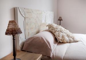 A bed or beds in a room at Mk77 - Gran Via