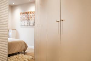 A bed or beds in a room at Mk77 - Gran Via