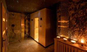 a bathroom with a walk in shower next to a door at Pensjonat Laworta Ski in Ustrzyki Dolne +101 photos