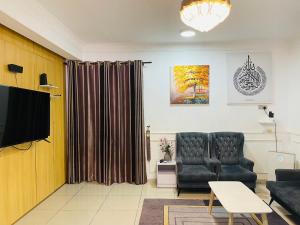 Ruang duduk di NO 121 NAZIRIN HOMESTAY TMN DESA MANJUNG