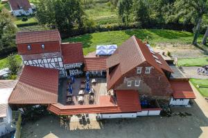 an overhead view of a large house with red roofs at Landhotel Kahltalmühle in Alzenau
