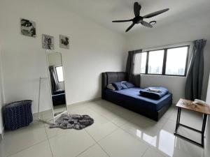 a living room with a couch and a ceiling fan at Traders Garden , cheras Trader square 3 bedroom Balakong serdang in Cheras