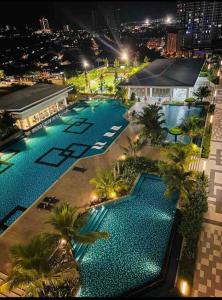 an overhead view of a swimming pool at night at Traders Garden , cheras Trader square 3 bedroom Balakong serdang in Cheras