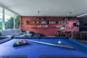 a living room with a pool table with two bats at Pago de Tharsys in Requena