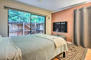 a bedroom with a bed and a large window at Santa Monica Townhome - Close to Beach! in Los Angeles