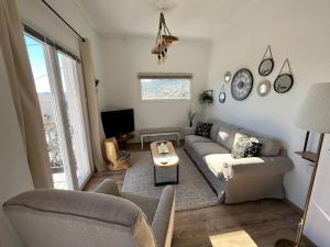 a living room with a couch and a table at «Έλα…Δάρα» Home in Daras