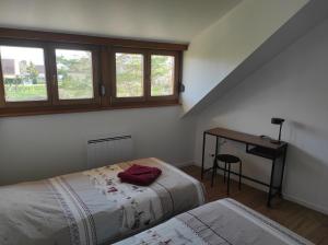 Posteľ alebo postele v izbe v ubytovaní GÎTE D’EMMA