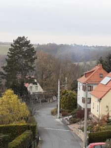 an empty street in a village with houses at FeWo Zur Alten Drechslerei in Freital