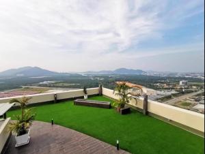 a view from the roof of a building with a green lawn at FREE WIFI-FI Travelers HomestySitiawan 5-8pax The Venus Aparment in Seri Manjung