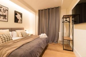 a bedroom with a bed and a window at Arriaga in Bilbao