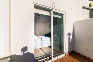 A bed or beds in a room at Babieca Casa con Garaje