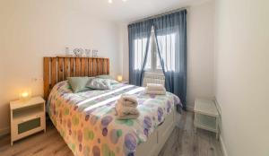 A bed or beds in a room at Babieca Casa con Garaje