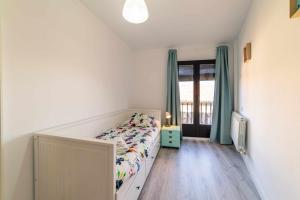 A bed or beds in a room at Babieca Casa con Garaje