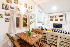 a dining room with a table and chairs at BunkyDew in Galle