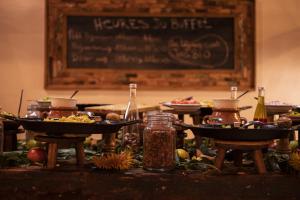 a table with a buffet of food and a chalkboard at Westpoint Dakhla in Dakhla