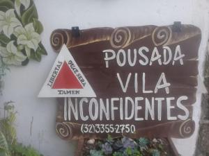 a sign that reads puebla villa incidents at Pousada Vila Inconfidentes - Centro Historico in Tiradentes