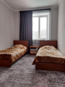Voodi või voodid majutusasutuse University Hotel Tsakhkadzor toas