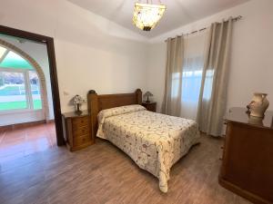 Posteľ alebo postele v izbe v ubytovaní VILLA MACARENA