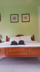 Ένα ή περισσότερα κρεβάτια σε δωμάτιο στο LANTA LUCKY HOUSE