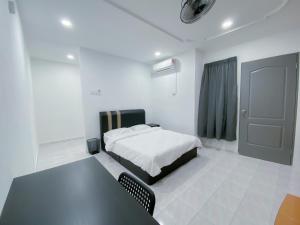 Venice Guest Hostel - Bilik Sahaja客房内的一张或多张床位