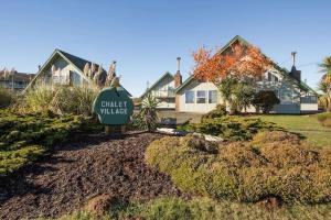 a house with a street village sign in front of it at Tidal House 9 in Ocean Shores