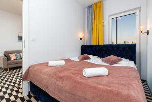 Posteľ alebo postele v izbe v ubytovaní Central Business District Warsaw Apartments by Noclegi Renters
