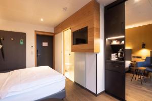 Cuina o zona de cuina de Engimatt City & Garden Hotel