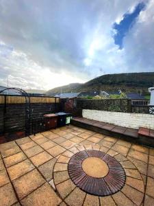 a view of a patio on a building at Newly renovated, hi-spec three bed, forest view home in Cwmcarn