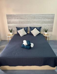 a bedroom with a bed with two towels on it at PENSIUNEA UNO in Timişoara