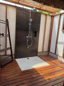 a shower on a deck with a ladder at Bann Pae Cabana Hotel And Resort in Klaeng