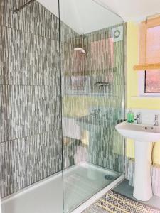 a bathroom with a shower and a sink at The Chalet in Fort Augustus