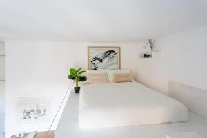 Säng eller sängar i ett rum på Cozy Suite Pigneto