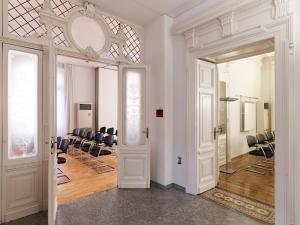a white room with chairs and a room with a mirror at Business Center IN Villa in Bellinzona