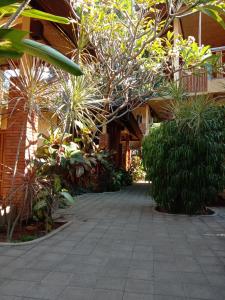 a courtyard with a bunch of trees and plants at Depotrek Villas in Amed