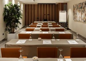 a large room with rows of tables and chairs at Catalonia Plaza Mayor in Madrid +28 photos