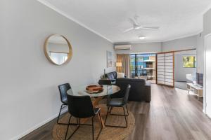 a living room with a table and chairs at Unit 41 at Portobello Dicky Beach in Caloundra