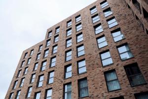 a tall brick building with lots of windows at Canvas Glasgow - in City Centre in Glasgow