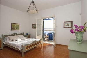 Postel nebo postele na pokoji v ubytování Sea Front Villa