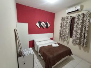 Cama ou camas em um quarto em Pousada Córdoba