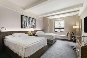 En eller flere senge i et værelse på Hyatt Grand Central New York