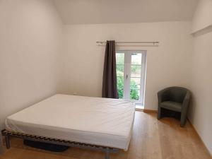 Posteľ alebo postele v izbe v ubytovaní La maison du voisin