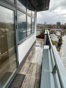 a balcony of a building with a view of a city at One bedroom with Great city views in London