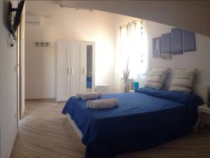 Postel nebo postele na pokoji v ubytování Spegni La Luce b&b