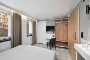 Postel nebo postele na pokoji v ubytování Hotel Halo Szczyrk