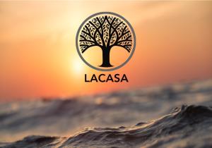 a logo of a tree in the middle of a wave at LaCasa 1 Deluxe Villa with Pool and Jacuzzi in Roumelí