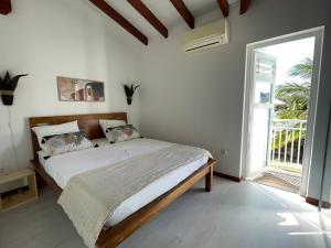 Postel nebo postele na pokoji v ubytování Villa Colibri