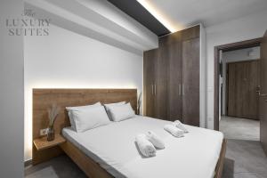 Posteľ alebo postele v izbe v ubytovaní Adelle Apartments, The Luxury Suites